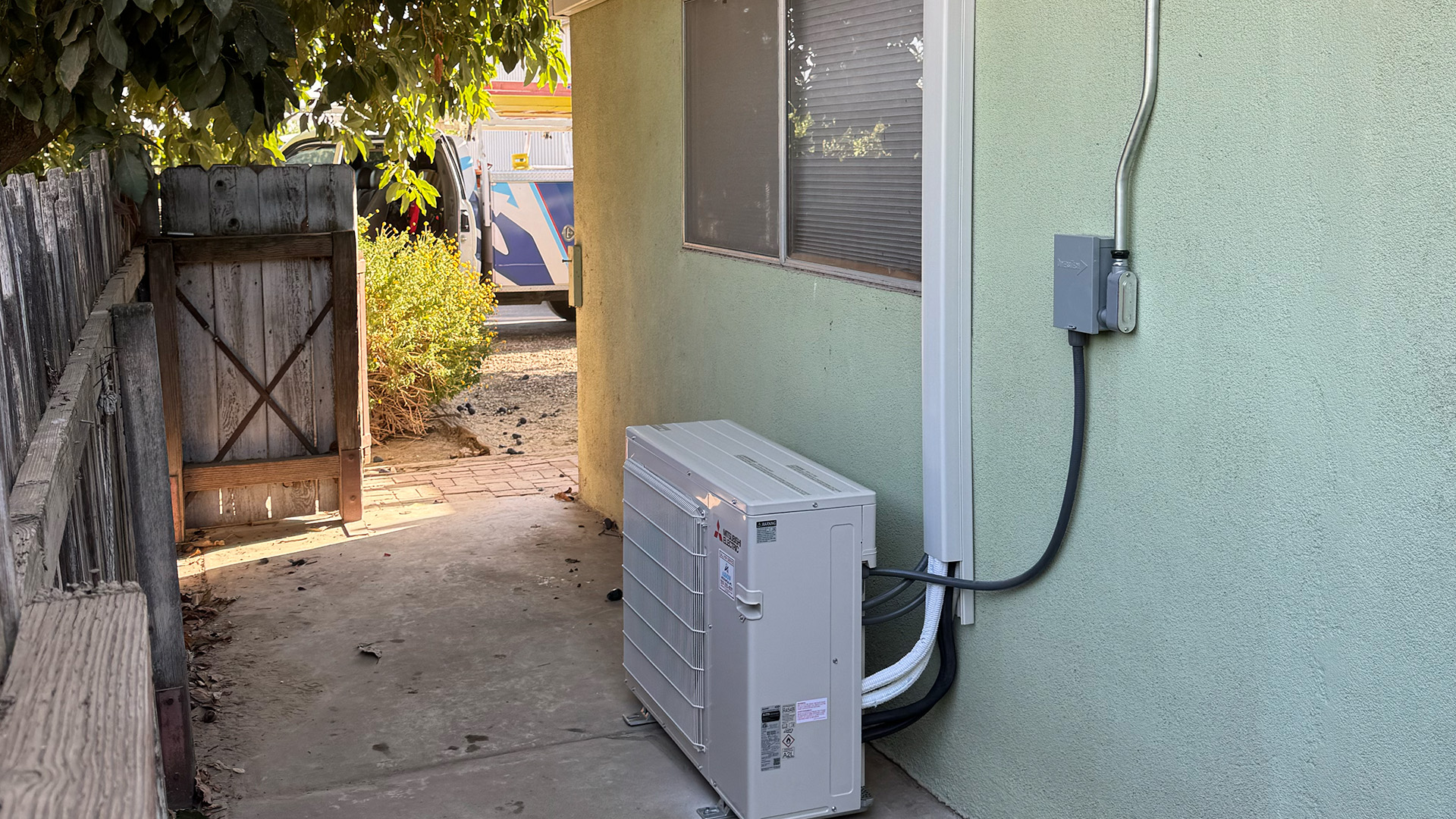 Mini-split installation behind a residential home